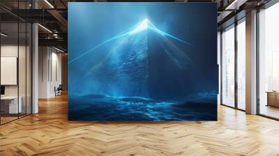 Illuminated Pyramid in a Mystical Landscape - A glowing pyramid with blue lights beams across a mysterious landscape. The pyramid's peak is obscured by a white glow. Wall mural