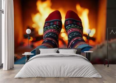 Warm socks with festive patterns, worn by a person relaxing by a cozy fireplace. The scene exudes comfort and holiday cheer in a rustic setting. Wall mural