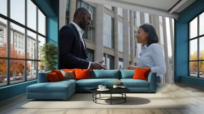 African business people talking standing outside office building Wall mural