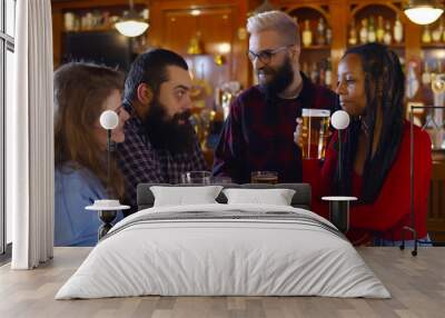 Happy multiethnic people drinking beer at brewery bar Wall mural