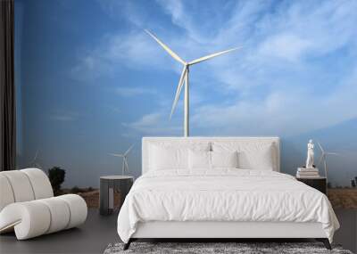 wind turbine against cloudy blue sky background Wall mural