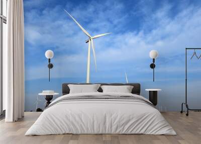 wind turbine against cloudy blue sky background Wall mural