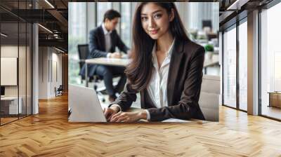 Asian business woman working on a laptop in a professional office Wall mural