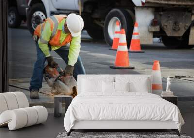 A construction worker with reflective vests and helmet performing urban road maintenance Wall mural