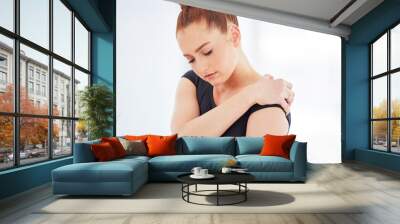 Injury can occur in any sport and ballet is no exception. Shot of a young ballerina suffering from shoulder pain. Wall mural