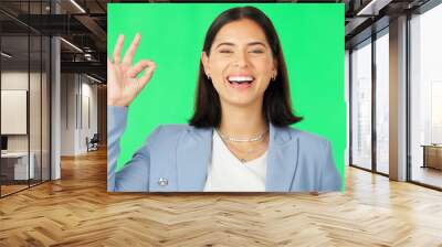 Ok hands, face and happy woman on green screen, background and review of business support. Portrait of female employee, smile and okay for success, yes and bonus for perfect emoji, thank you and sign Wall mural