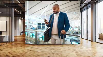 Black man with phone, airport and online check in or flight schedule in terminal for business trip. Smile, travel and happy businessman checking visa or international destination time on mobile app. Wall mural