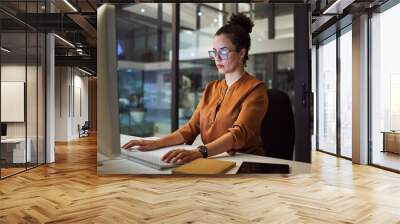 Computer, thinking or business woman in night office of digital marketing startup, advertising agency or creative Mexico company. Designer, worker and employee on technology for brand growth deadline Wall mural