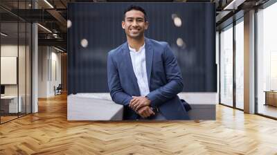 I have career goals to achieve. Cropped portrait of a handsome young businessman standing on a balcony in in the city. Wall mural