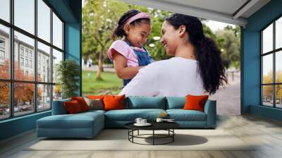 Happy, family and mother with daughter in a park, laughing and playing while bonding outdoor together. Love, black woman and girl embracing in a forest, sweet and caring, relax and smile for joke Wall mural