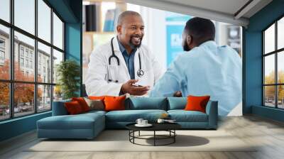 Happy, talking and doctor with a black man for healthcare, support and advice on treatment. Smile, consulting and an African gp with a patient speaking about medicine, health and professional help Wall mural