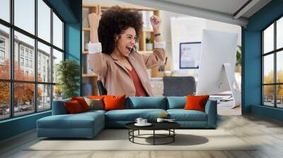 Happy woman winning on computer success, bonus or celebration for news, sales and business cheers in office. Wow, yes and winner or biracial person celebrate, fist pump and reading opportunity on pc Wall mural