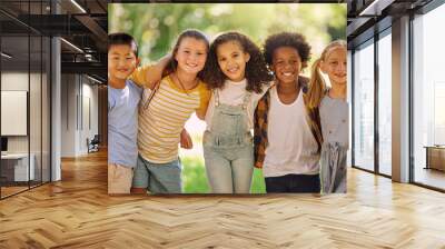 Portrait, friends and children standing in a line together outdoor, feeling happy while having fun or playing. Diversity, school and smile with kids in a row, posing arm around outdoor in a park Wall mural