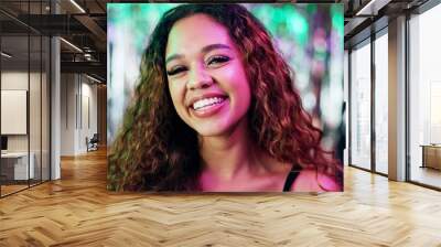 Happy, nightclub and portrait of woman at party with neon lighting for celebration or fun event. Smile, confident and face of female person from Puerto Rico at rave, disco or dj gig for entertainment Wall mural