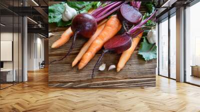 fresh organic carrot and beetroot with garlic on old wooden back Wall mural