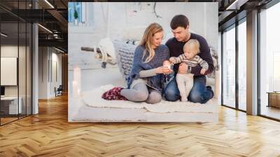 Lovely family holding fire together Wall mural