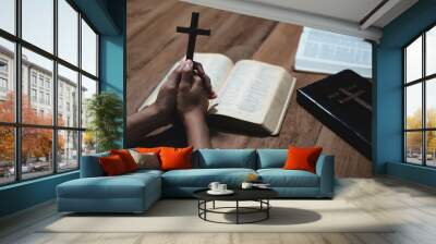 Asian men and women hands praying to god with the bible. Pray for god blessing. Religious beliefs Christian life crisis prayer to god. Wall mural