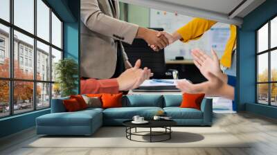 Business team shake hands confidently professional investor working with new startup project at an office meeting. Wall mural