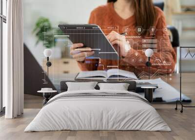 Business women hand working with tablet and laptop computer with documents on office desk in modern office. Wall mural