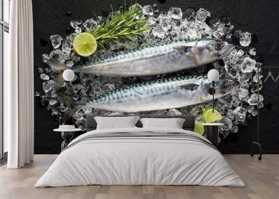 Fresh fish on ice on a black stone table top view Wall mural