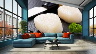 Scallops on black stone plate Wall mural