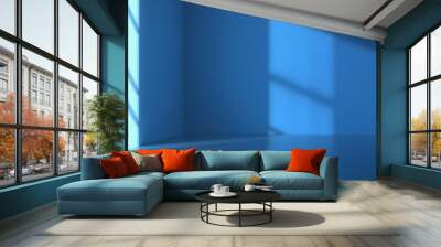 Minimalist blue room with window shadow. Wall mural