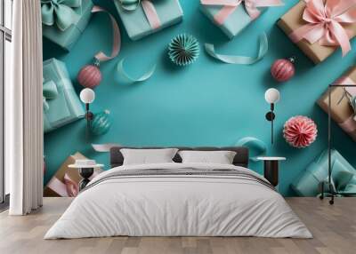 A turquoise background with gift boxes tied in velvet ribbons and surrounded by paper decorations Wall mural