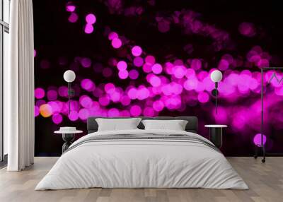 Bokeh light background of beautiful party at night. Pink and purple bokeh. Wall mural