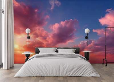 A breathtaking sunset sky, with vibrant hues of orange, pink, and blue, is captured from a high vantage point, showcasing the dramatic cloud formations and the sun's descent. Wall mural