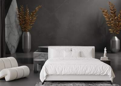 A minimalist black and white marble pedestal with a round top sits on a gray marble floor, flanked by two silver vases with golden foliage. Wall mural