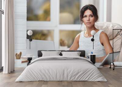 Young brunette business woman in a modern office Wall mural