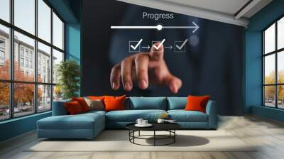 Businessman or manager touching on checklist to tick correct mark with progressive loading status to remind work task progressive for project develop management and tracking concept. Wall mural