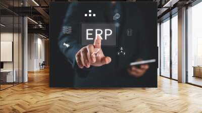 Enterprise Resource Planning (ERP), business resource planning software system. On a virtual screen, businessman touching on ERP button, Finance accounting, sale marketing. Wall mural