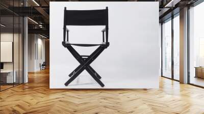 Back of black director chair use in video production or movie and cinema industry on white background. Wall mural