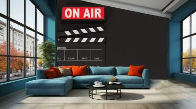 Black clapperboard or movie slate and on air on black background. Wall mural