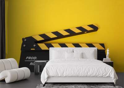 Clapper board or movie slate. it use in video production and cinema industry on yellow background. Wall mural