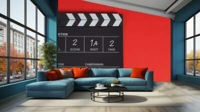 Clapperboard or clap board or movie slate .It is use in video production ,film, cinema industry on red background. Wall mural