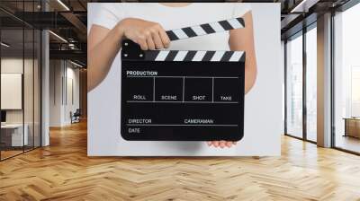 Hands is holding black Clapperboard or movie slate. it use in video production ,film, cinema industry on white background. Wall mural