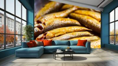 Marinated Indian Raw Fish. Bengali raw mullet fish or parshe mach marinated with turmeric, salt and various spices in a bowl ready for cooking. Background for regional food, cover, sea food cuisine. Wall mural