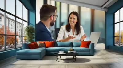 Busy happy business woman professional bank manager lawyer attorney consulting client on finances management. Female executive speaking to colleague working at office corporate meeting. Wall mural