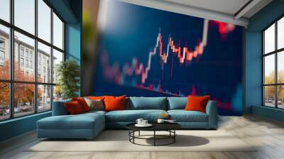 Closeup financial chart with uptrend line candlestick graph in stock market on blue color monitor background Wall mural