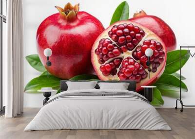 Juicy pomegranate and its half with leaves on white background Wall mural