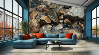 Capture the rough surface of natural stones in a riverbed Wall mural