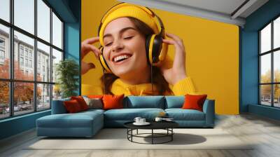 A teenager young woman with headphone listen to music with happiness, World hearing day. Wall mural