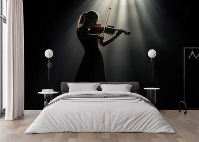 Female artist playing the violin on a dark stage, illuminated by a single spotlight, her body leaning into the music, performing arts, musician, pose Wall mural