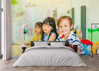 Blurry image of Happy children in a class of preschool. international School. Wall mural