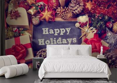 gifts and christmas ornaments and the text happy holidays Wall mural