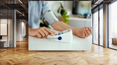 measuring his blood pressure at home Wall mural