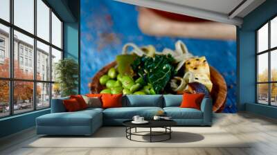 vegan dishes on a blue rustic table Wall mural