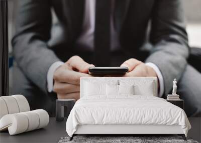 young businessman using a smartphone Wall mural